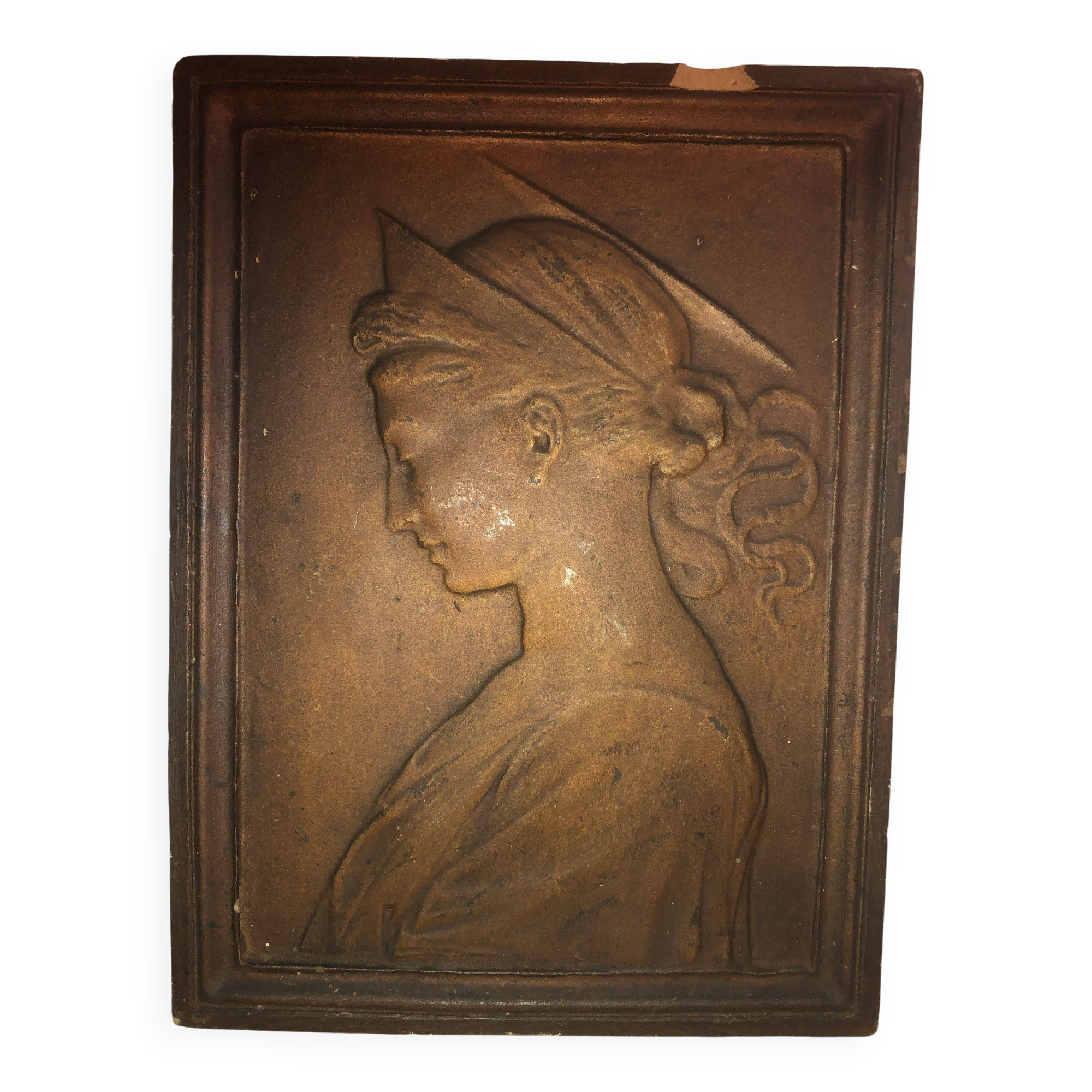 Patinated limestone bas-relief profile of a young woman