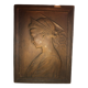 Patinated limestone bas-relief profile of a young woman