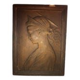 Patinated limestone bas-relief profile of a young woman