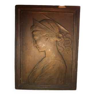 Patinated limestone bas-relief profile of a young woman