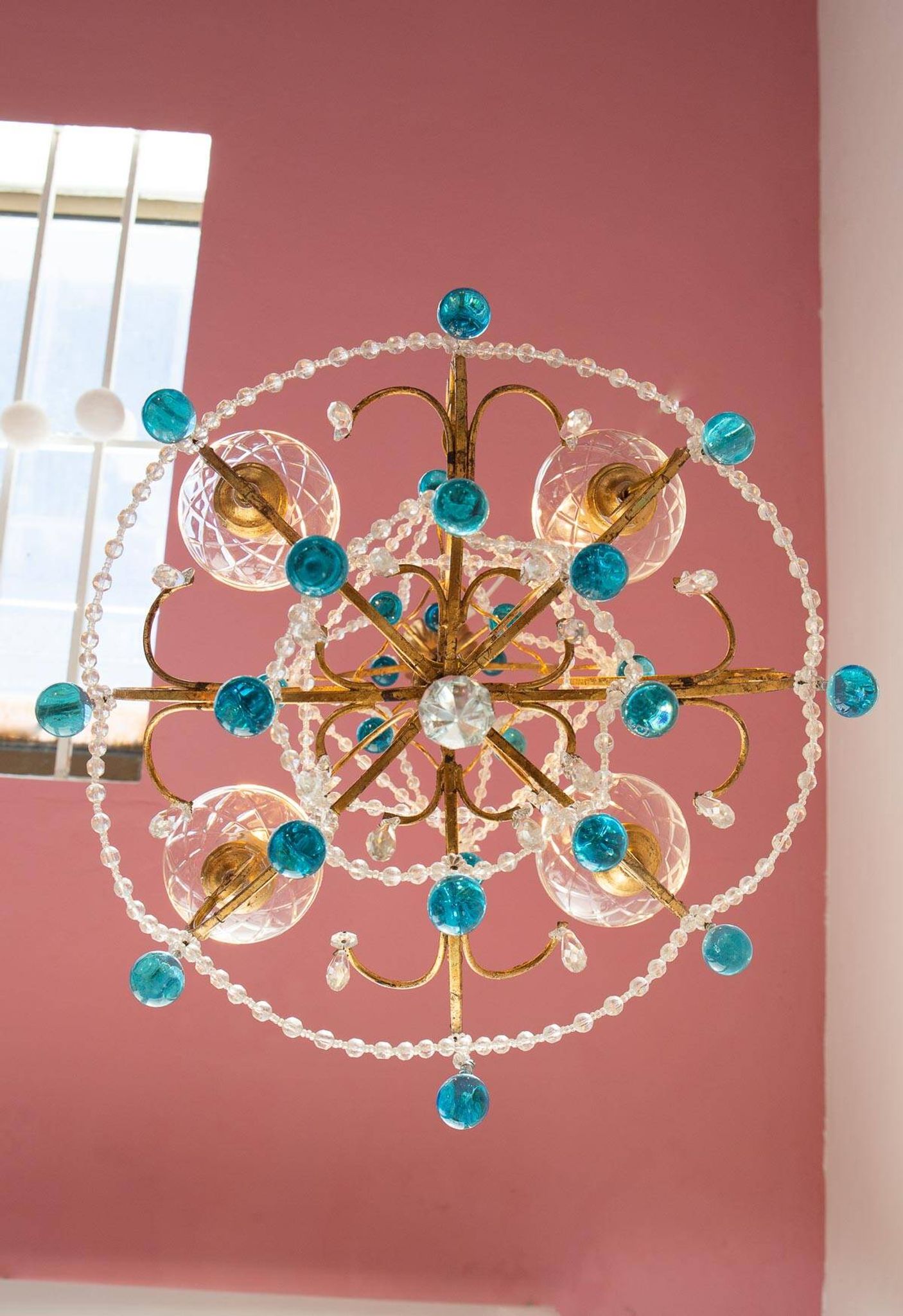 Italian chandelier in gold metal and blue crystal drops