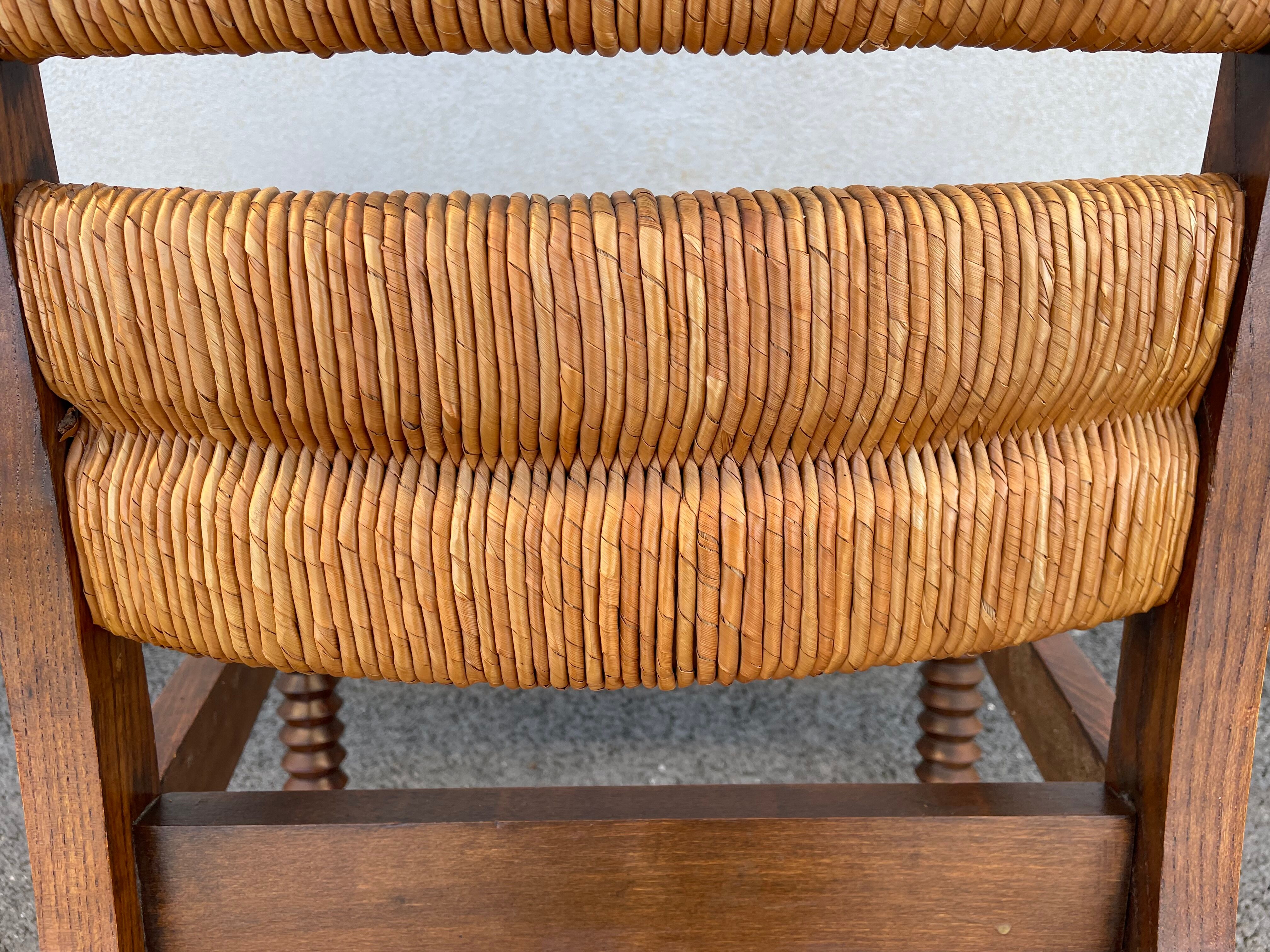 Vintage armchair in straw and brutalist wood