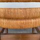 Vintage armchair in straw and brutalist wood