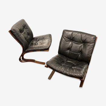 Two Kengu leather and teak armchairs