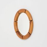 Sculptural wall mirror in solid pine