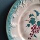 French antique barbotine plate decorated with stencil of grapes, faience de Castres