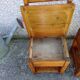 2 old wooden children's chairs with a small chest.
