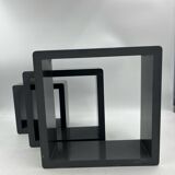 3 nesting shelves in grey lacquer.