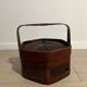 Ancient wooden and woven wicker basket,