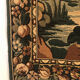Tapestry decorated with a pink flamingo in a green landscape, woven by hand