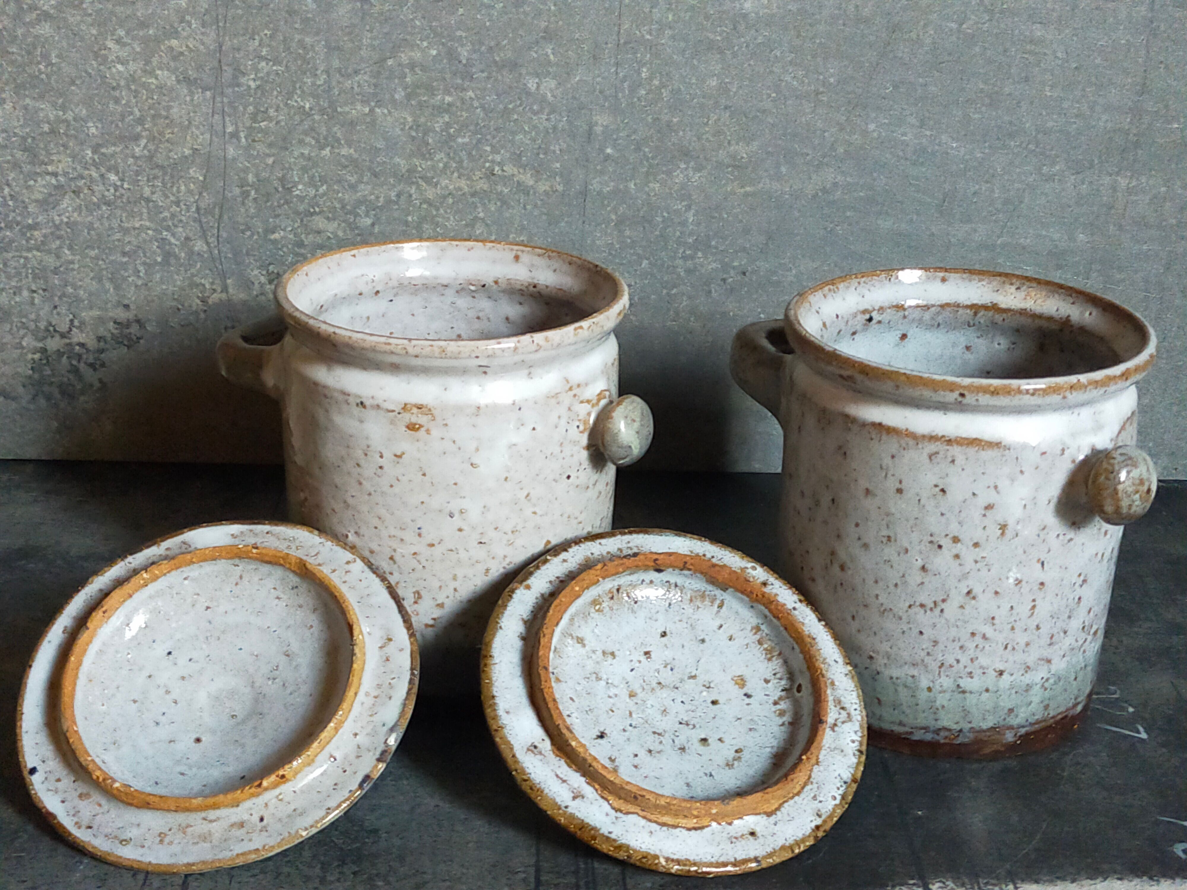 Duo of potter's pots covered in vintage glazed stoneware
