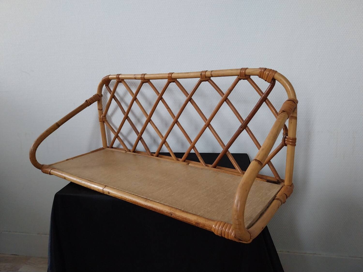 Rattan wall shelf