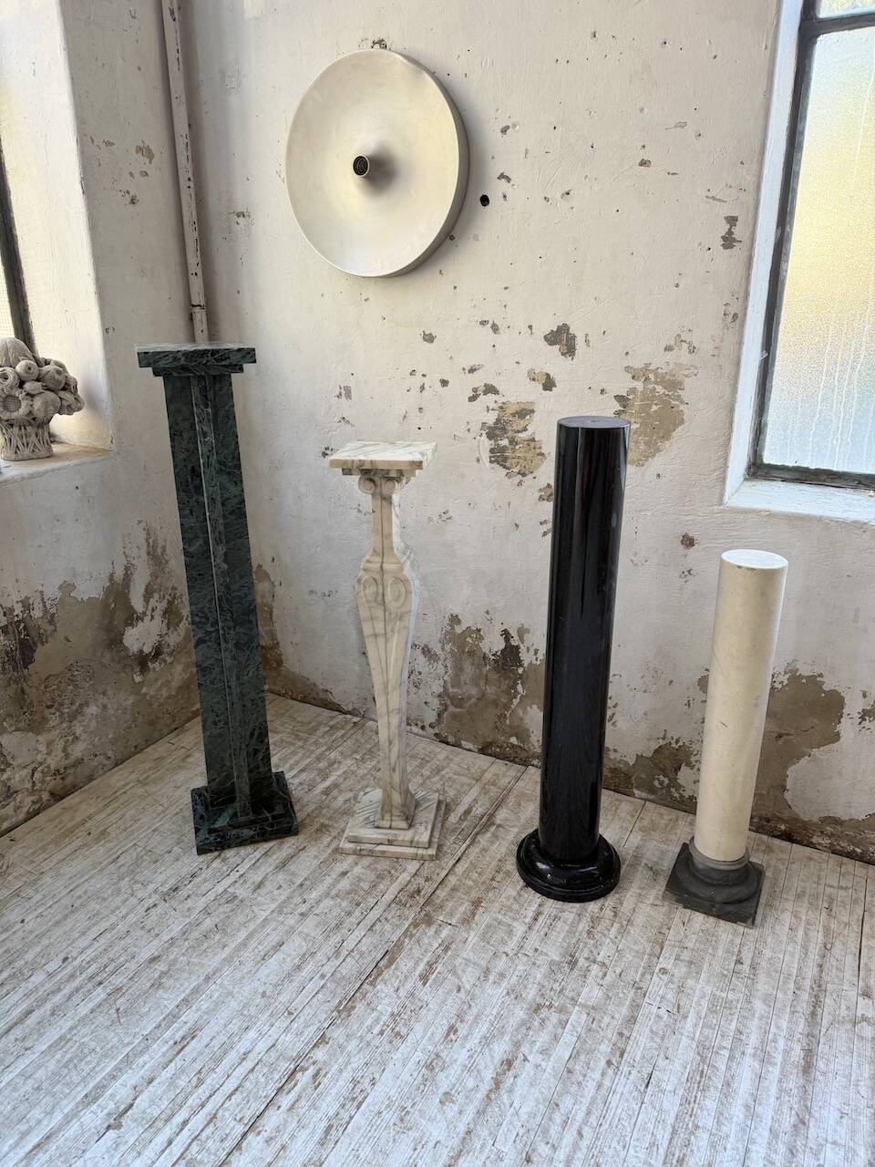 Set of 4 marble columns or pedestals.