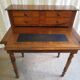 Old-tiered walnut desk
