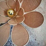Flower wall light made of rattan and nude linen petals