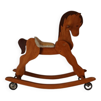 Vintage wooden rocking horse and casters