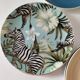 Set of 7 porcelain plates, gold foliage & jungle