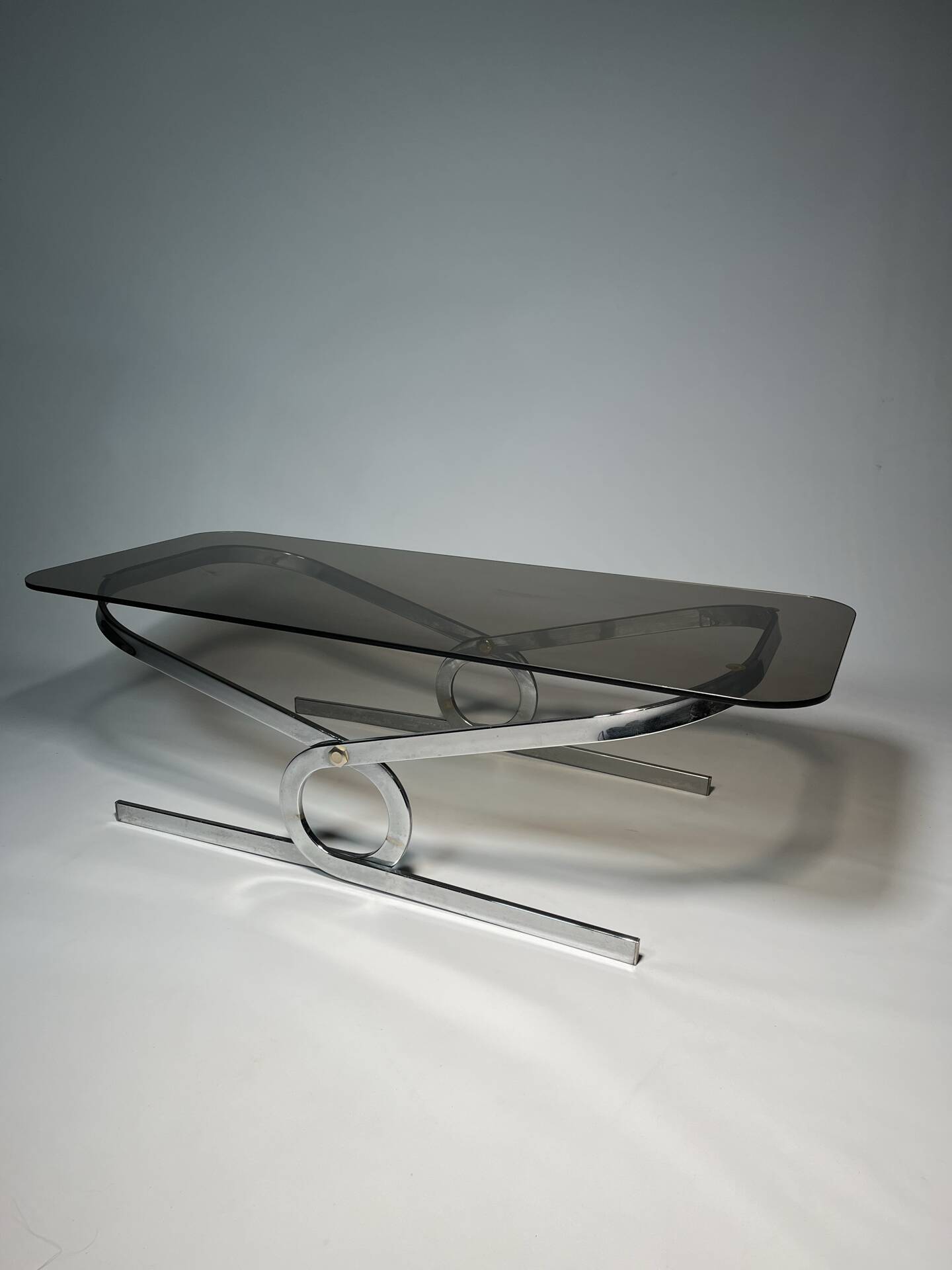 Vintage coffee table in chrome and smoked glass, 1970s.