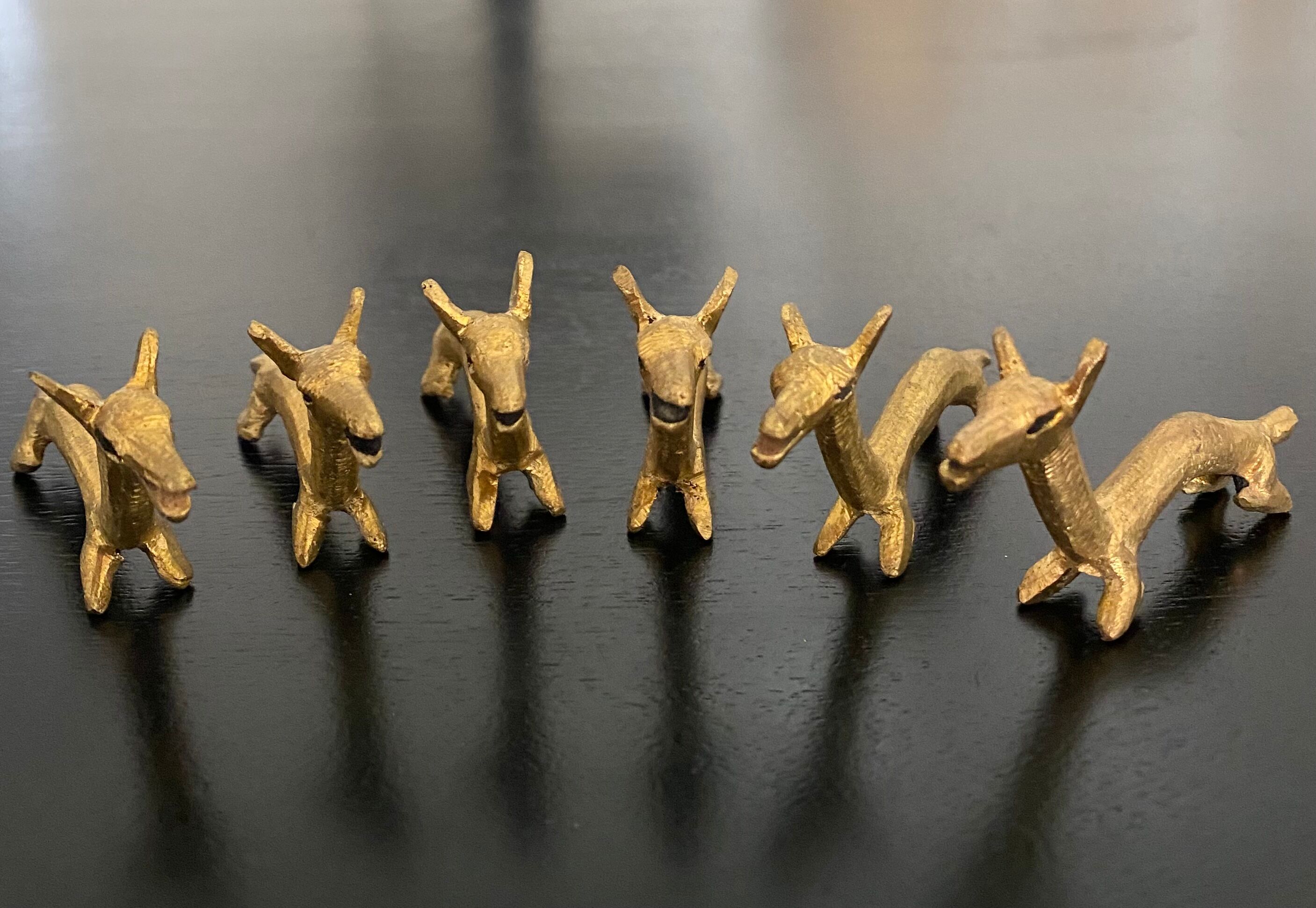 6 brass dromedary-shaped knife holders