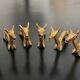 6 brass dromedary-shaped knife holders