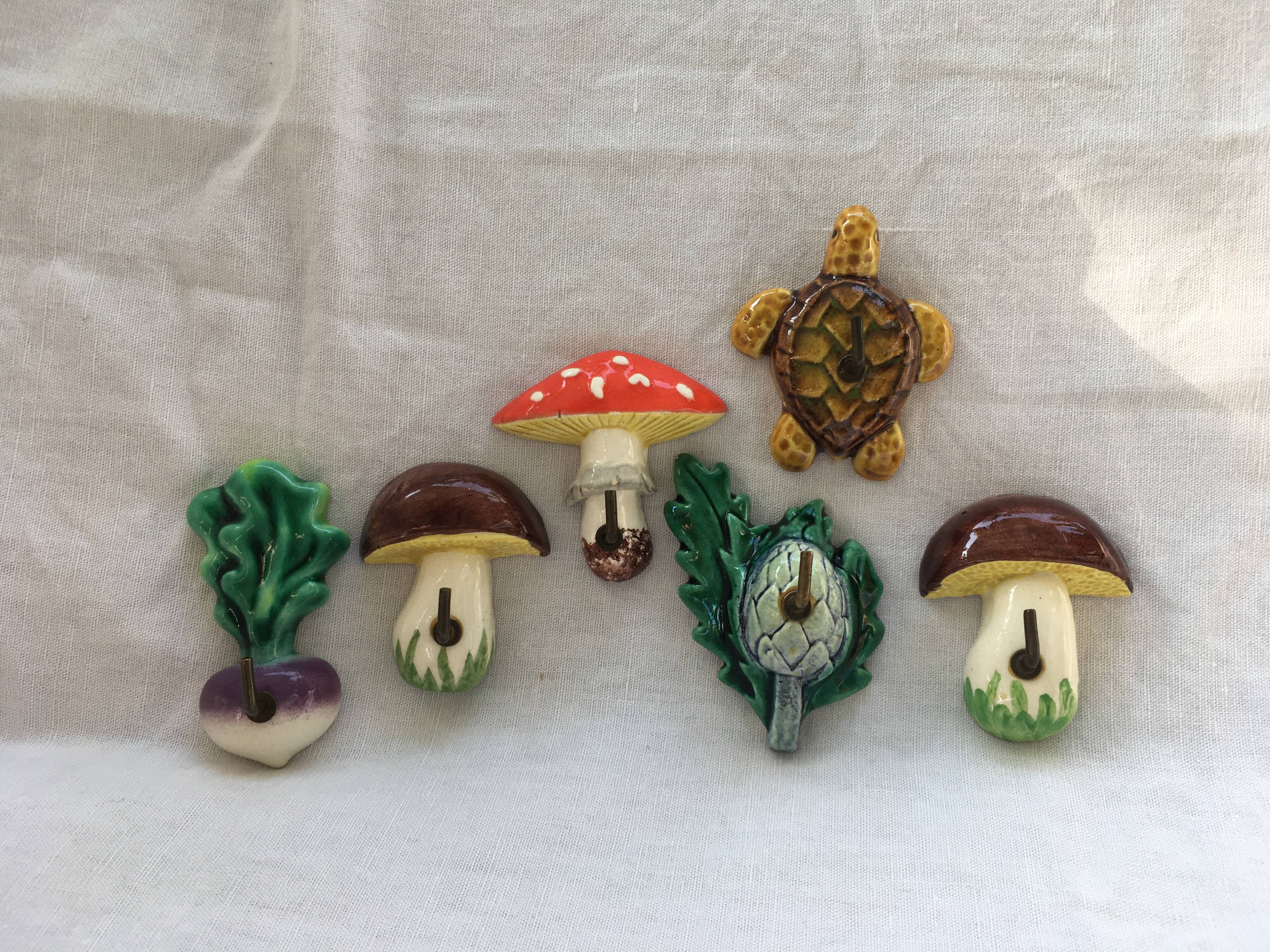 Lot of slurry hooks in the shape of plants and animals