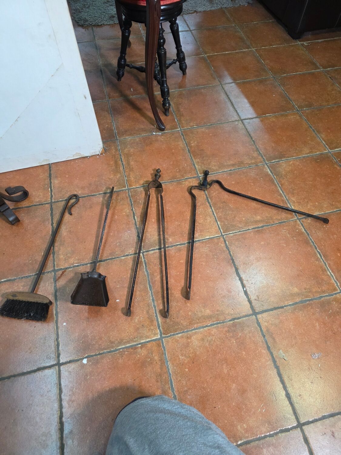 Antique fireplace set in solid wrought iron and brass.