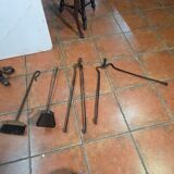 Antique fireplace set in solid wrought iron and brass.