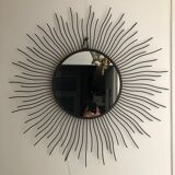 Sun mirror in black lacquered metal
