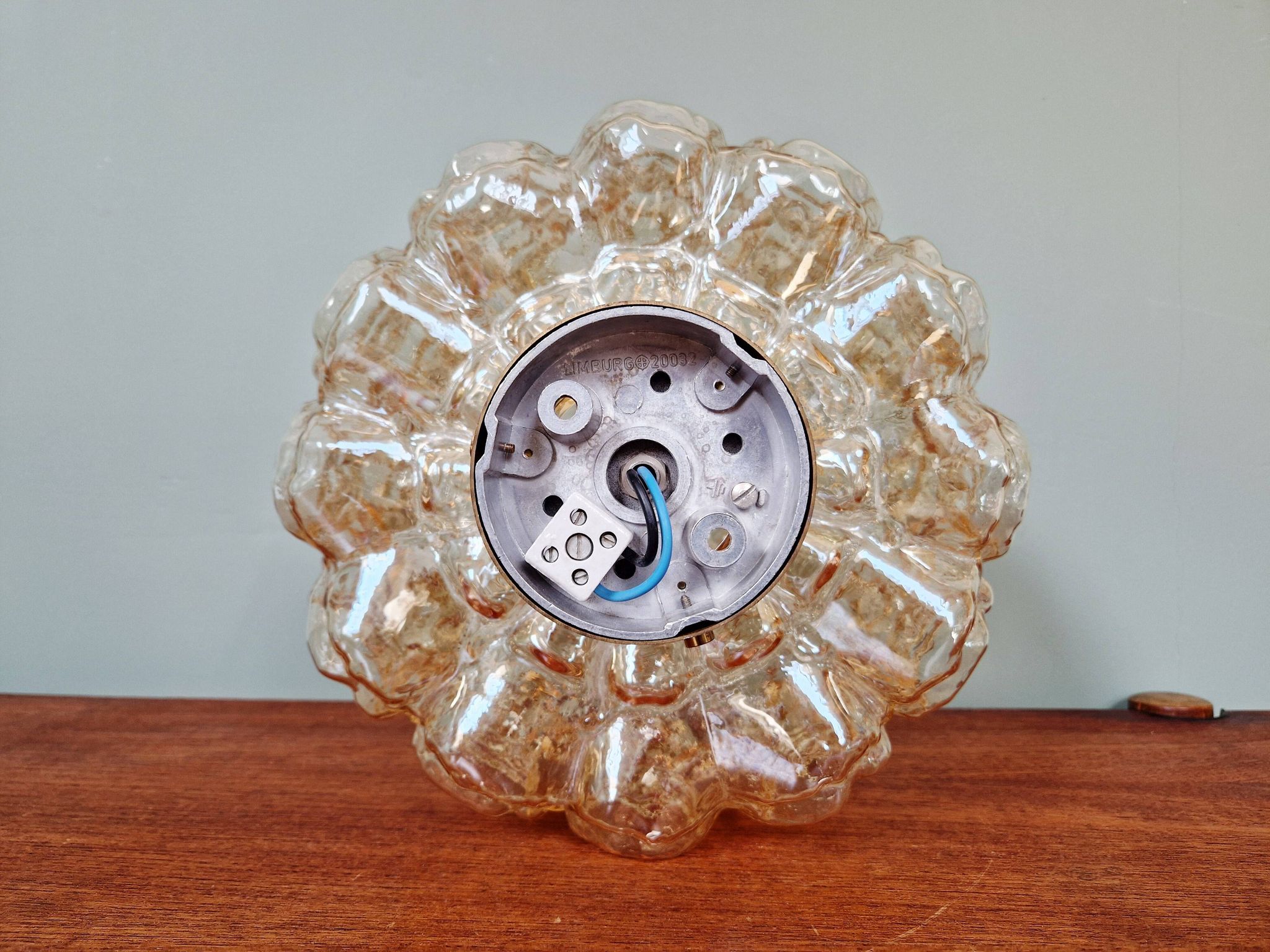 Brass and amber textured glass ceiling light, design by Helena Tynell, Limburg.