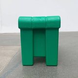 Postmodern plastic stool with a wood effect.