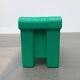 Postmodern plastic stool with a wood effect.