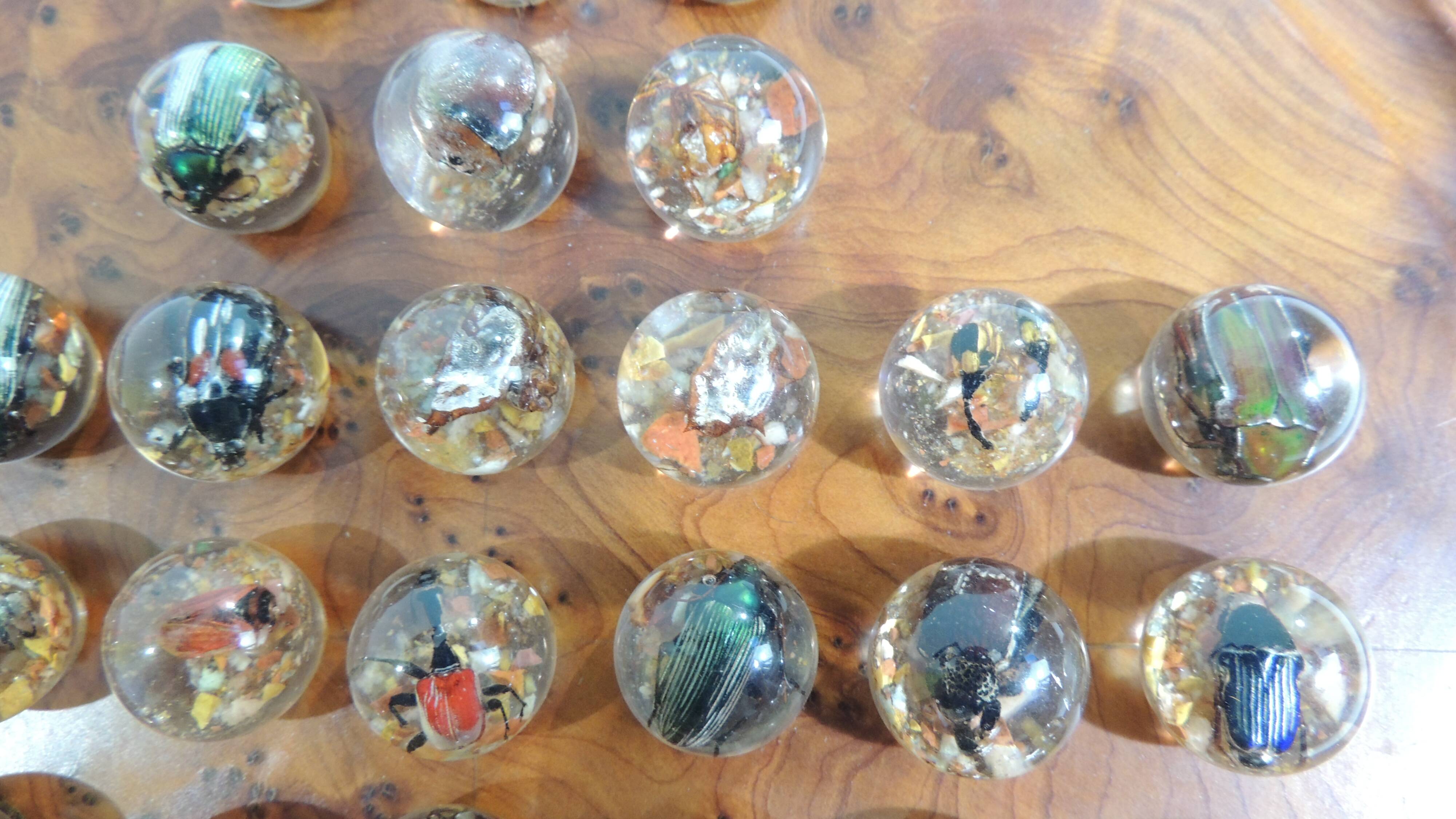 Vintage wooden solitaire game with resin balls and insects – Madaga