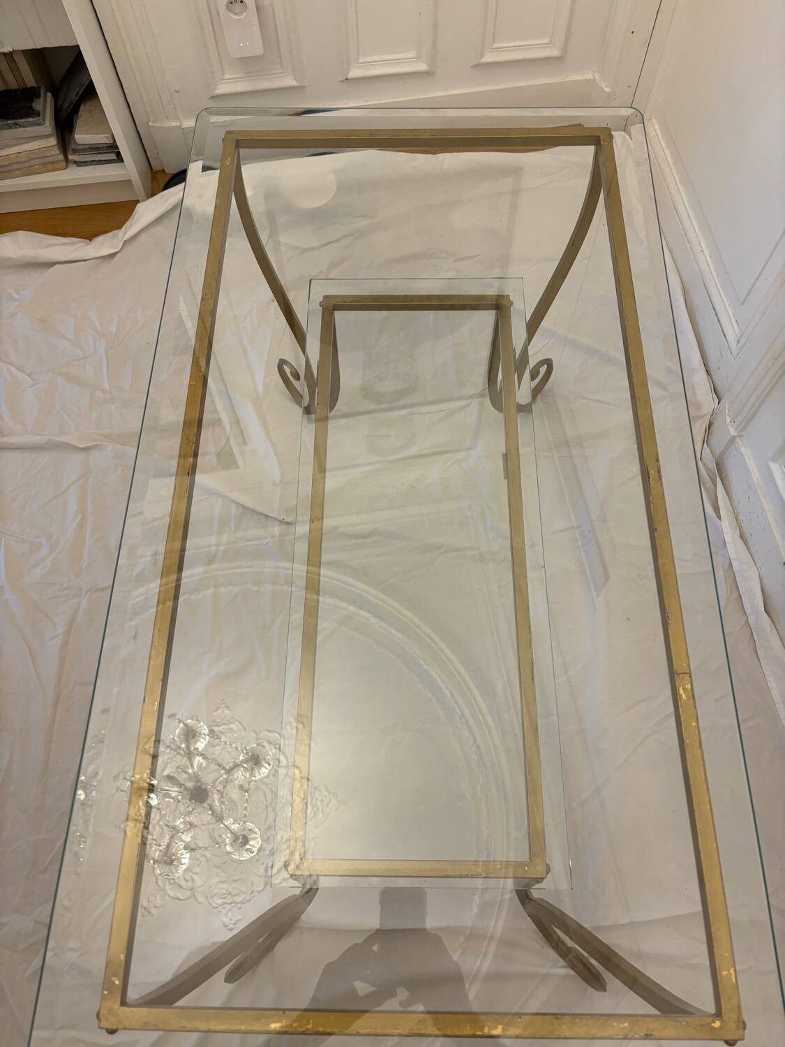 Large gold wrought iron and glass side table.