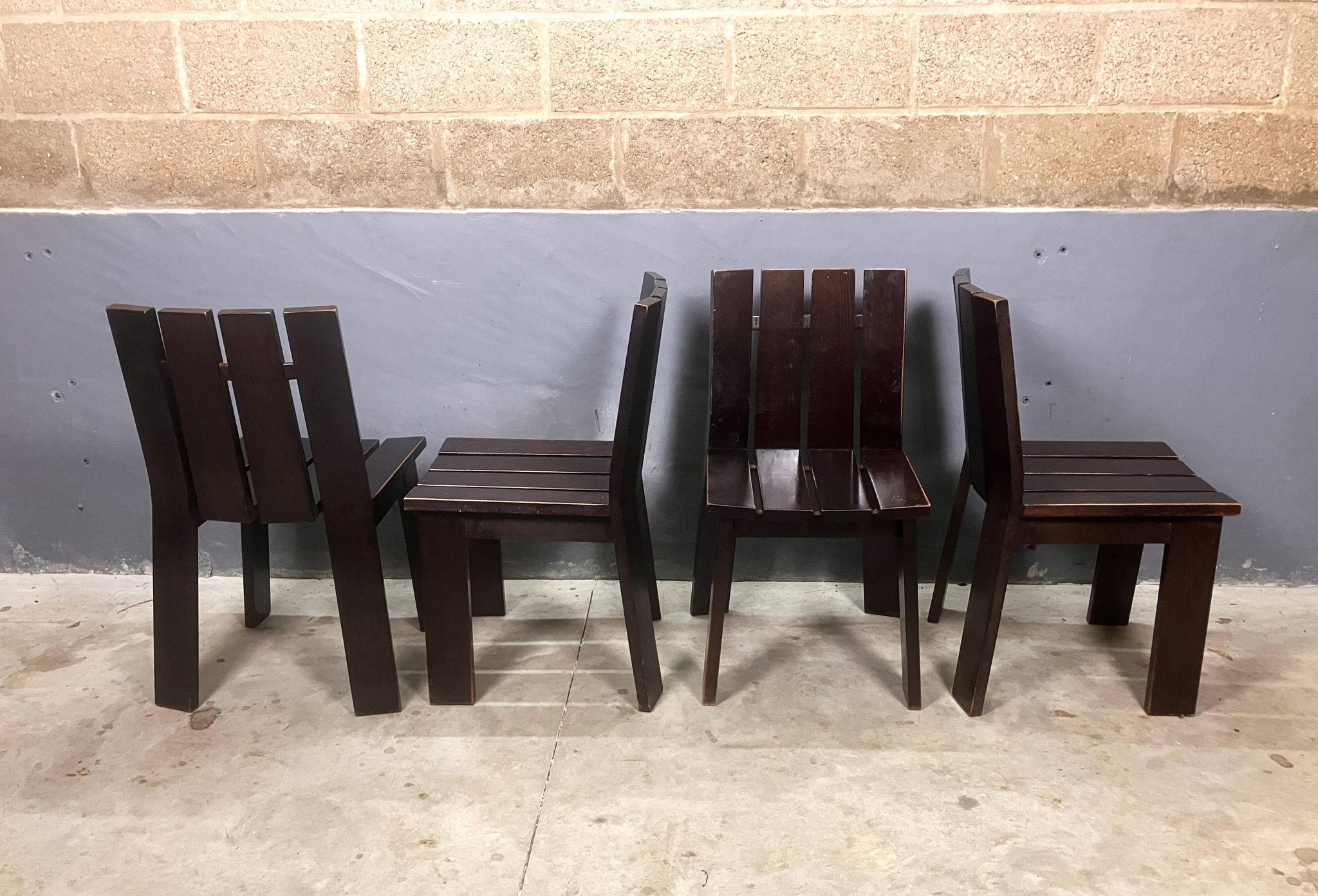 Brutalist and modernist dining chairs from the 1970s in architectural brown wood.