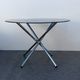 Designer smoked glass table, chrome Mikado base, vintage 1970