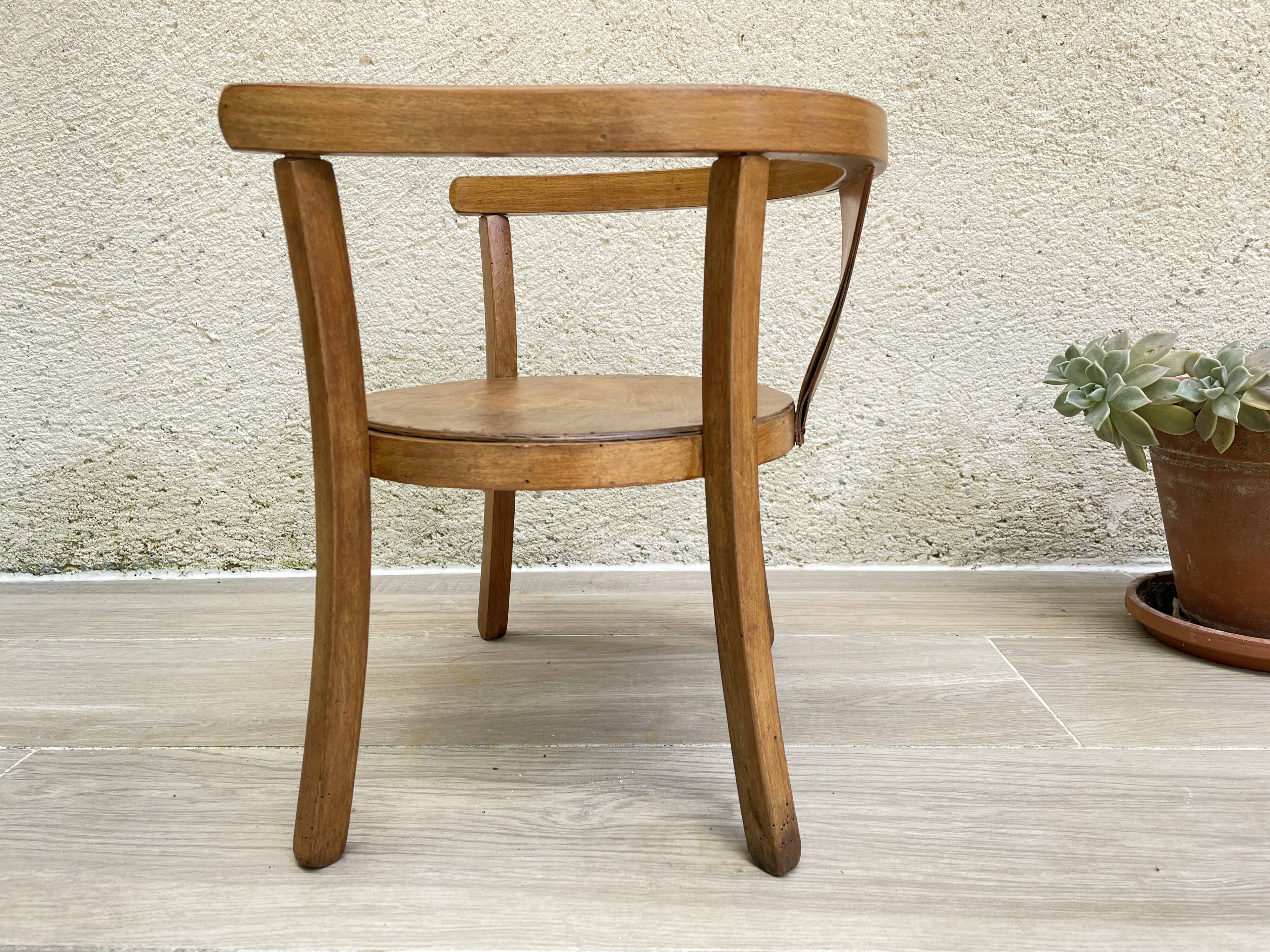 Old armchair for children in wood