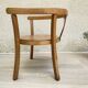 Old armchair for children in wood