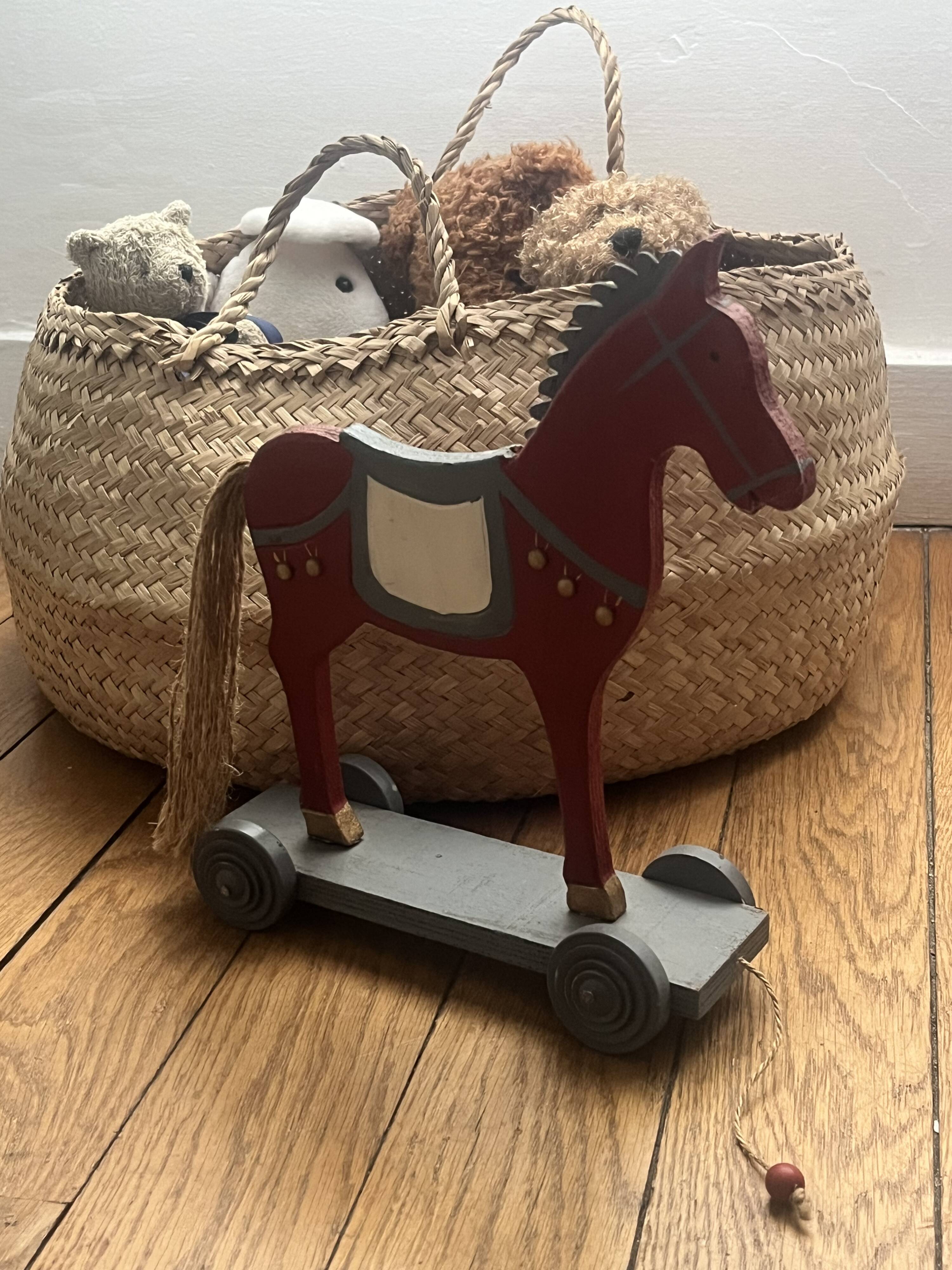 Antique toy, small horse on wheels
