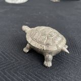 Ancient tortoise in silver metal