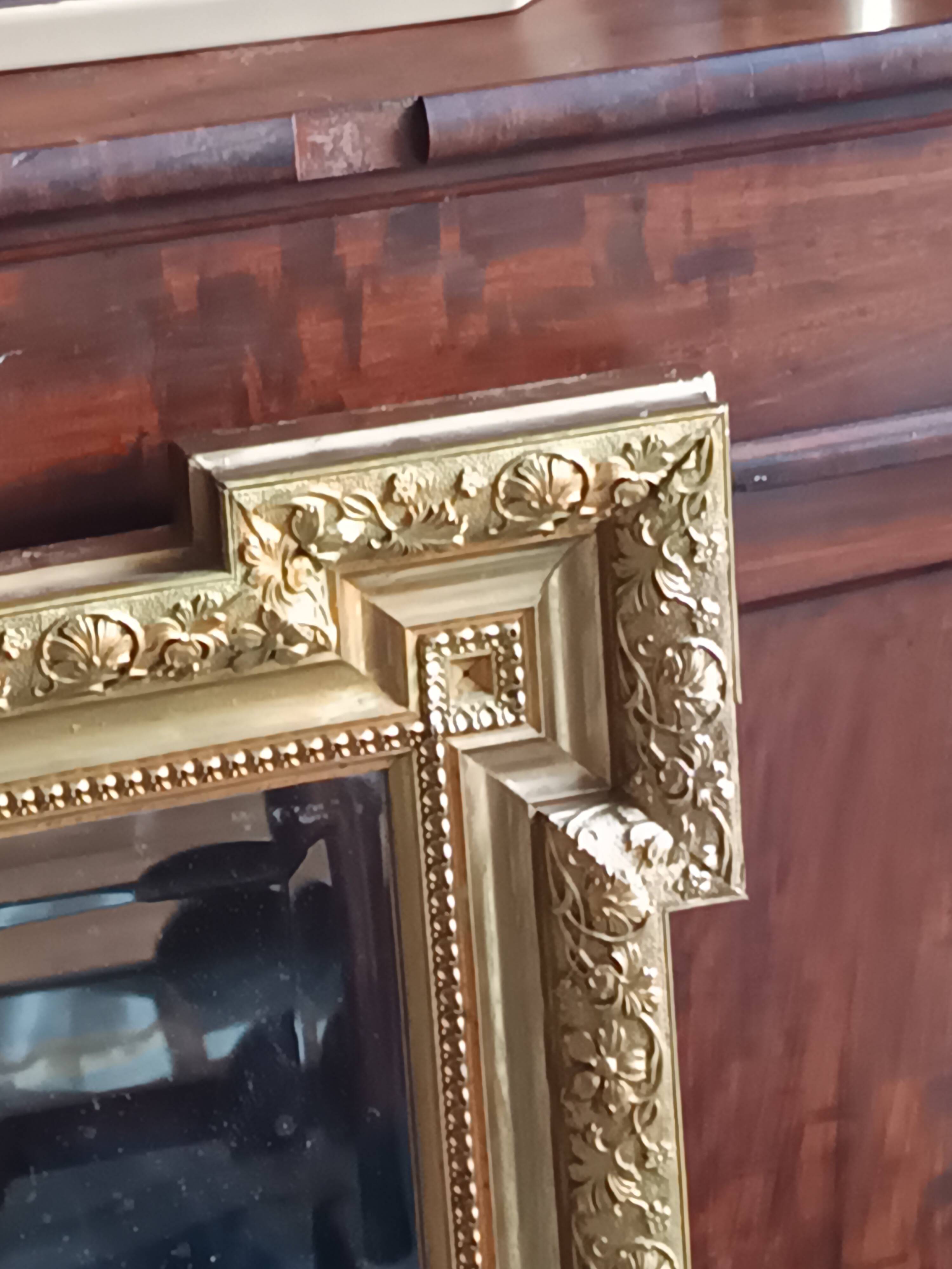 Antique mirror in wood and gilded stucco, neo Louis XVI style.