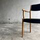 Set of 2 vintage beech wood armchairs with black skai upholstery — mid-century modern