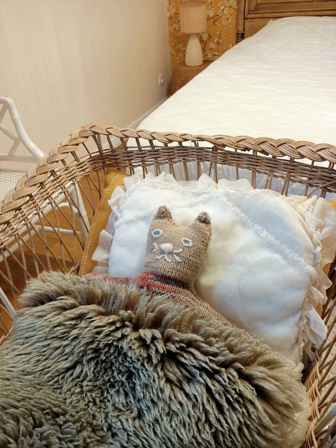 Rattan and wrought iron cradle