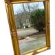 Miroir biseauté en bois doré