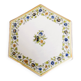 Hand-painted flat dish decorated in the Moustier style.