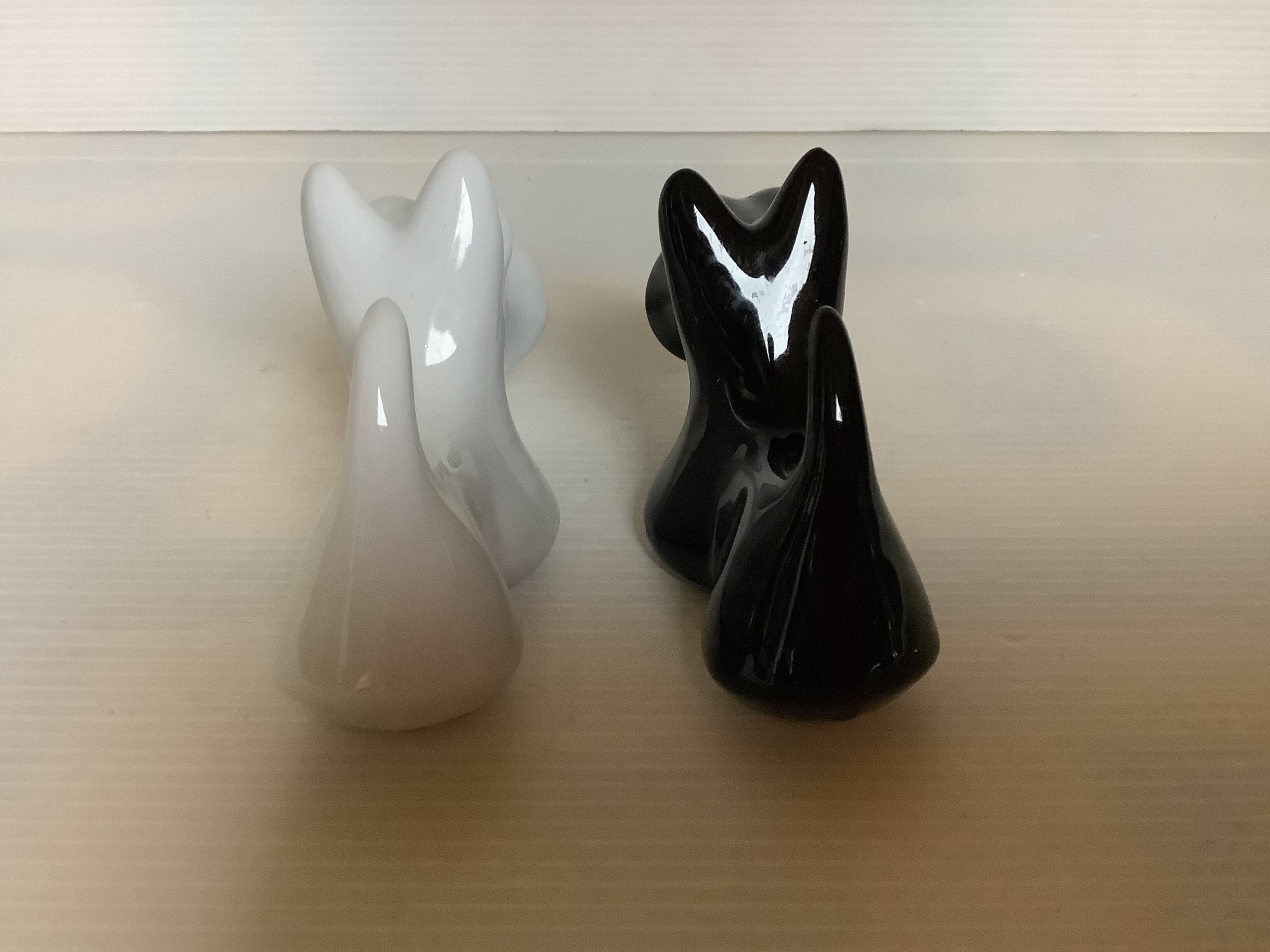 Salt and pepper black and white dogs.