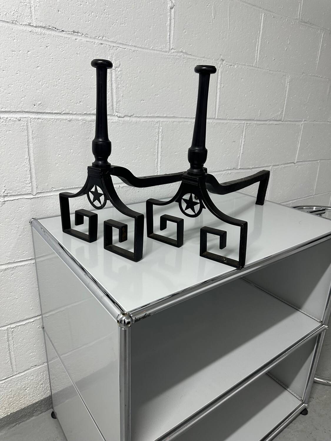 Pair of designer cast iron andirons