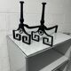Pair of designer cast iron andirons