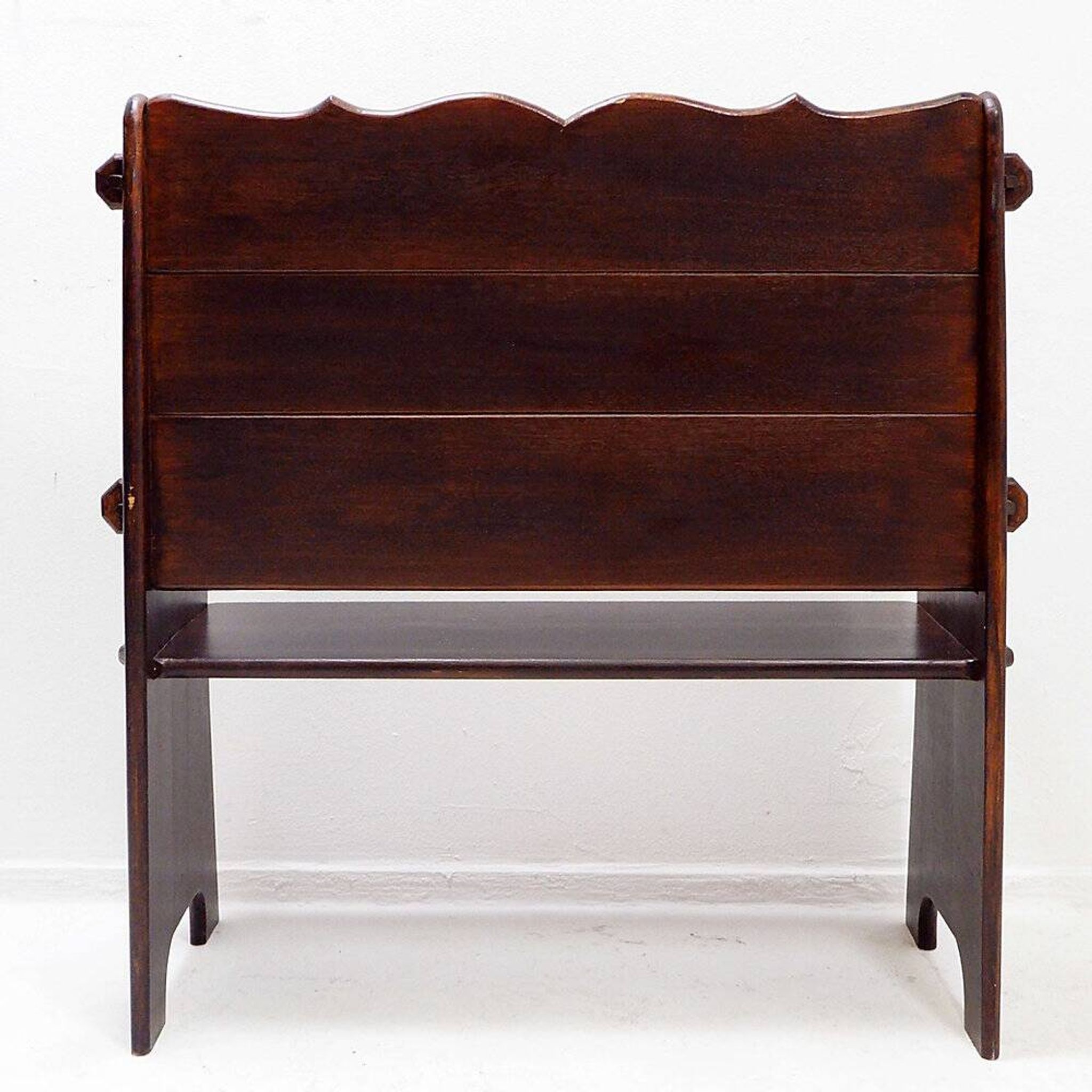 Vintage solid wood church bench from the 20th century.