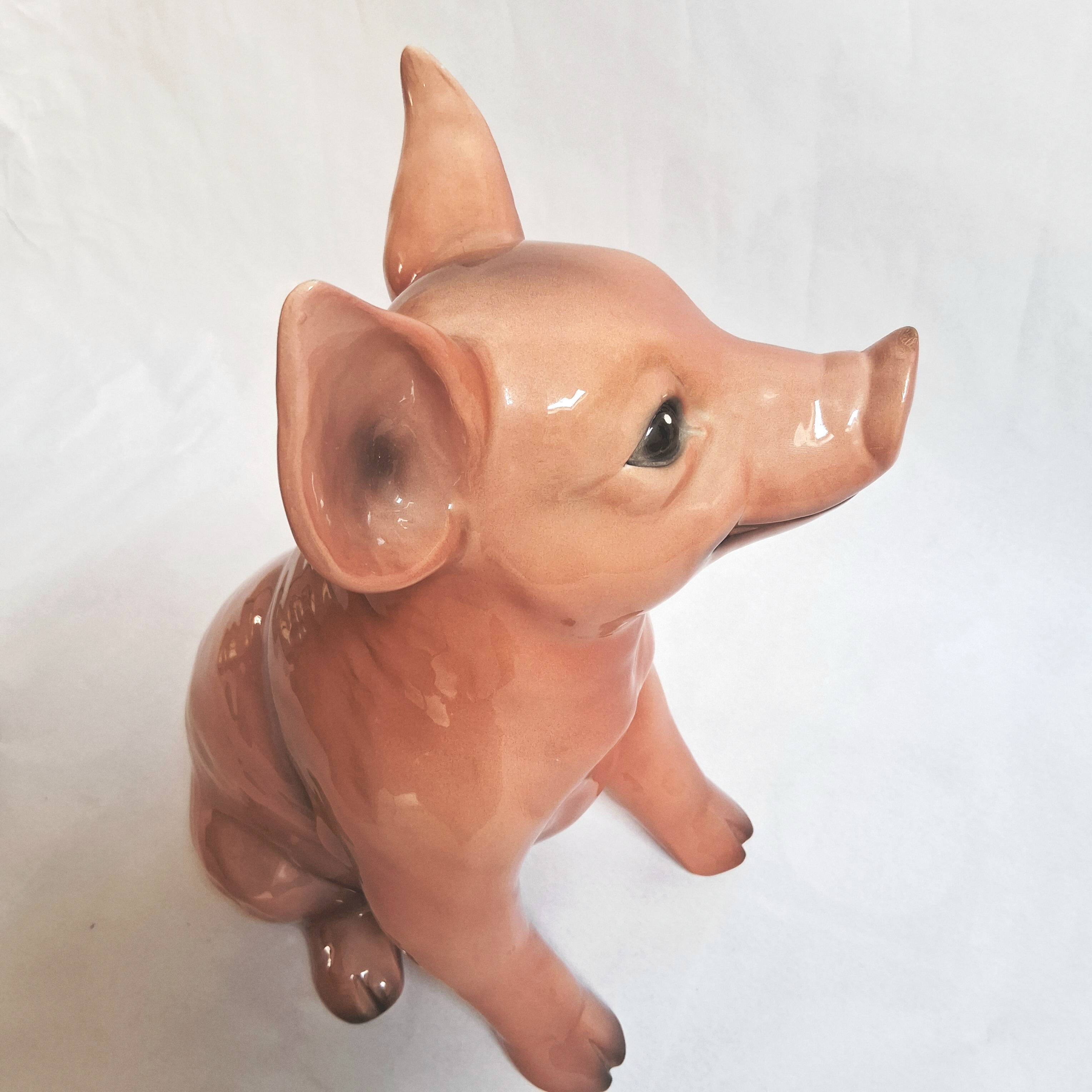 Beautiful, handcrafted porcelain figurine of a piglet, made by Capodimon.