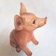 Beautiful, handcrafted porcelain figurine of a piglet, made by Capodimon.